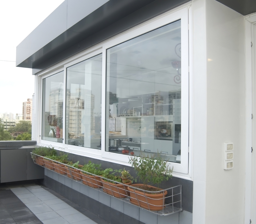 White sliding window on a terrace